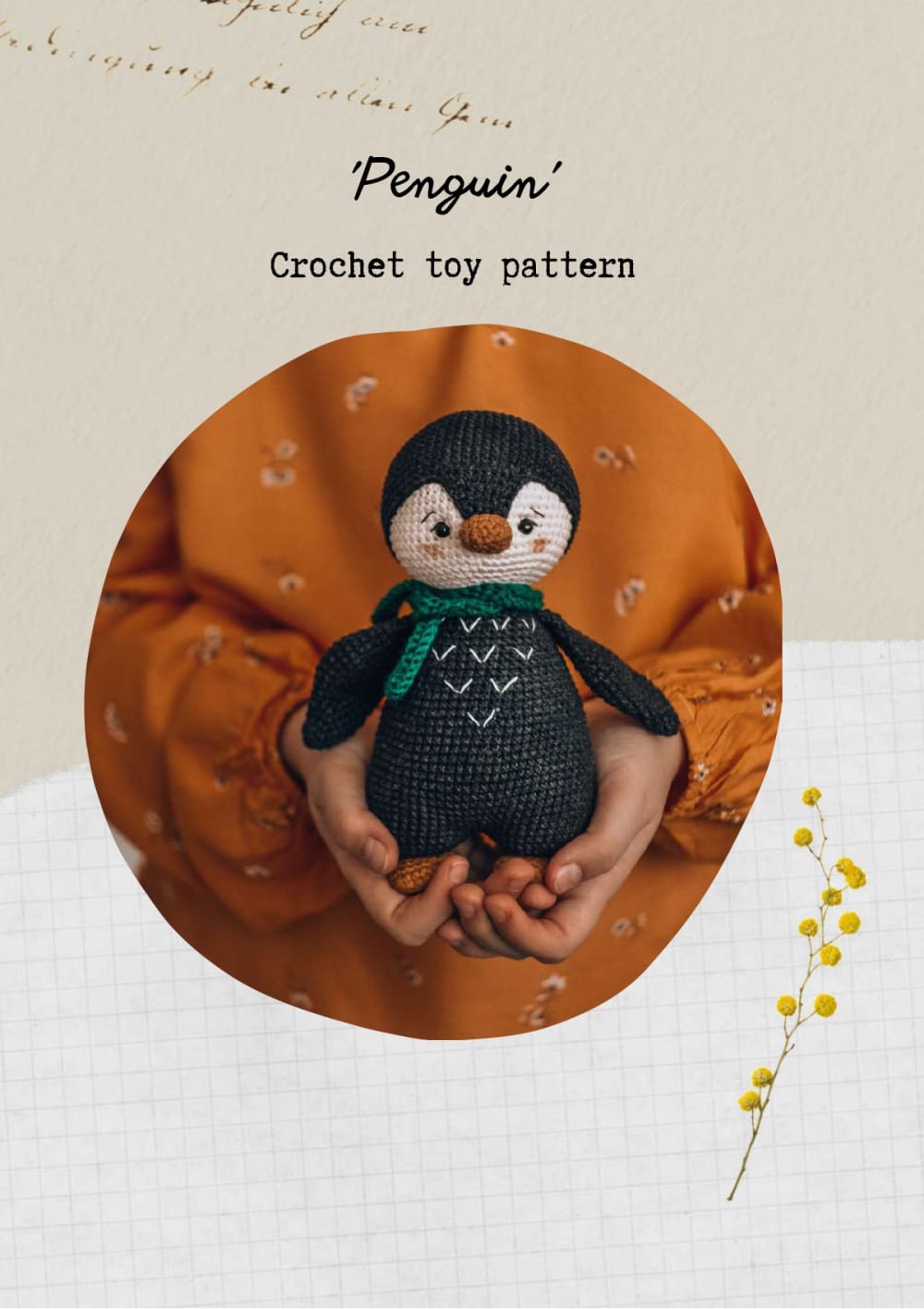 Black and cream crochet penguin with a scarf held in hands
