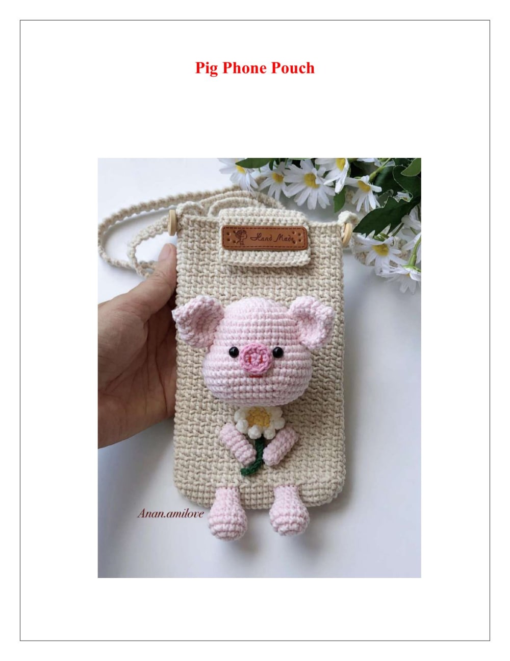 Beige crochet phone pouch with a pink pig peeking over the top