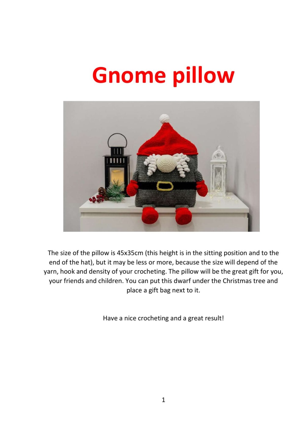 Plush crochet gnome pillow with a red hat and white beard by a Christmas display
