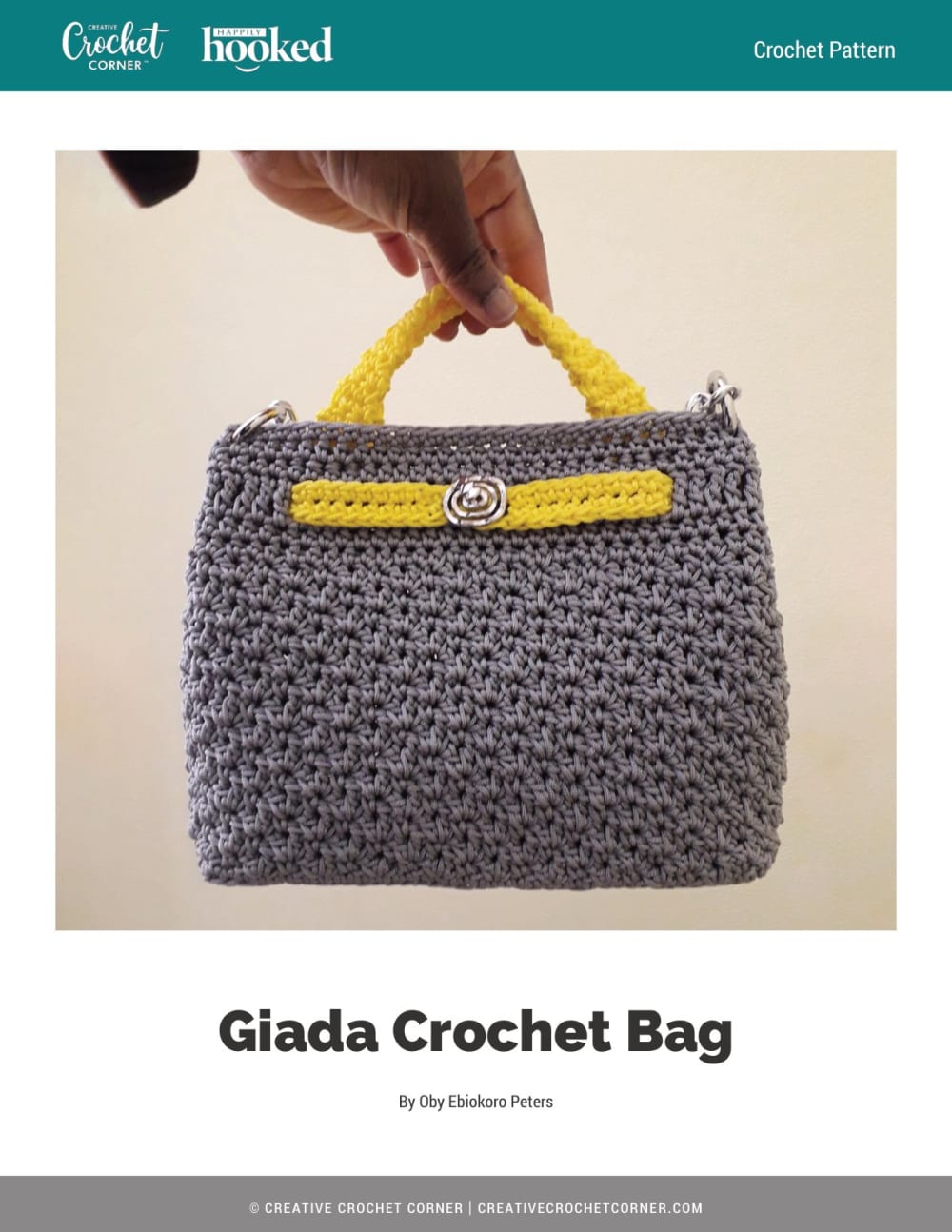 Grey crochet handbag with yellow handles and trim held up by hand