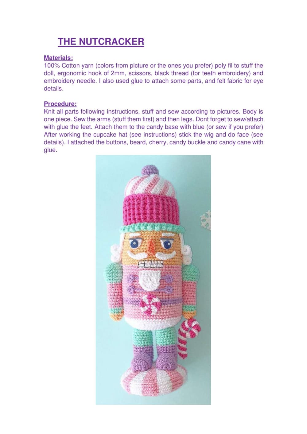 Pink and white crochet nutcracker with a cupcake hat and a candy cane