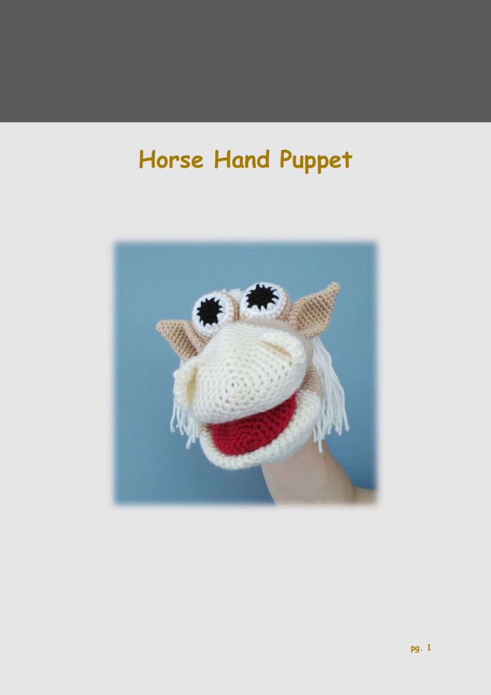 Crochet horse hand puppet with a white yarn mane and big eyes