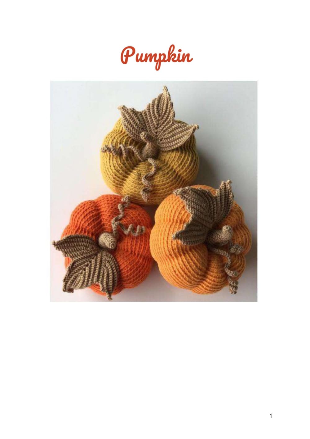 Crochet orange pumpkins with brown leaves and stems