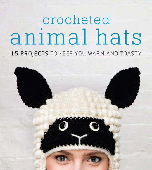 Crocheted animal hats book cover showing a woman in a white sheep hat with black ears and face