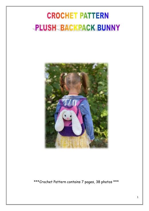Child wearing a purple and pink plush crochet backpack with a white bunny face and long ears