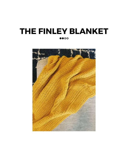 Mustard yellow bean stitch crochet blanket draped over a gray sofa