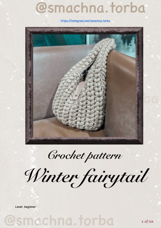 Taupe puff stitch crochet hobo bag with a curved handle on a leather sofa