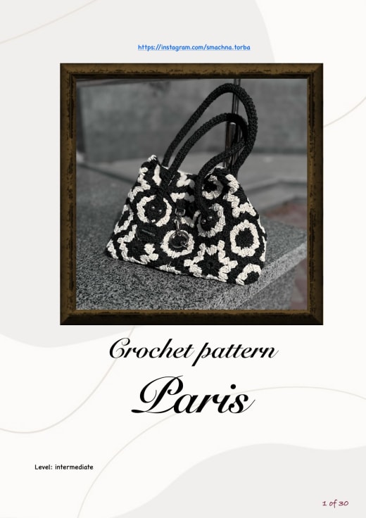Black and cream crochet hexagon handbag with a star pattern and two black handles