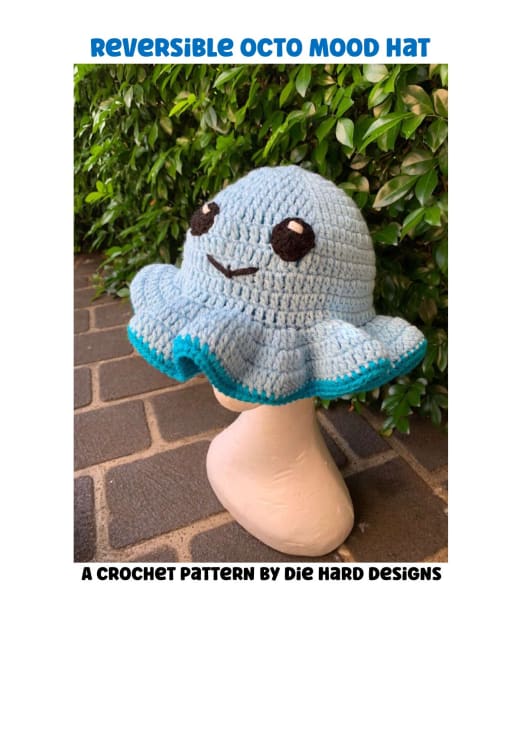 Light blue crochet octopus bucket hat with a smiling face and tentacle brim