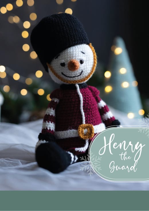 Henry the snowman guard in a red jacket and a tall black hat