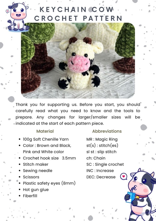 White chenille cow keychain amigurumi with black spots and a pink nose