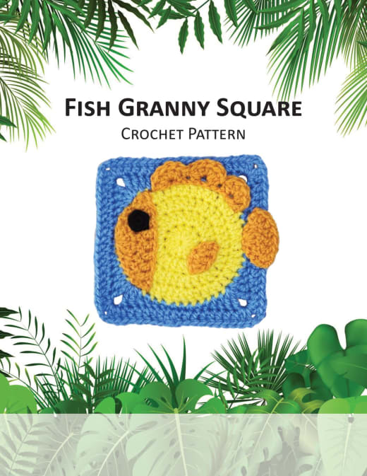 Blue granny square with a round yellow fish and orange fins
