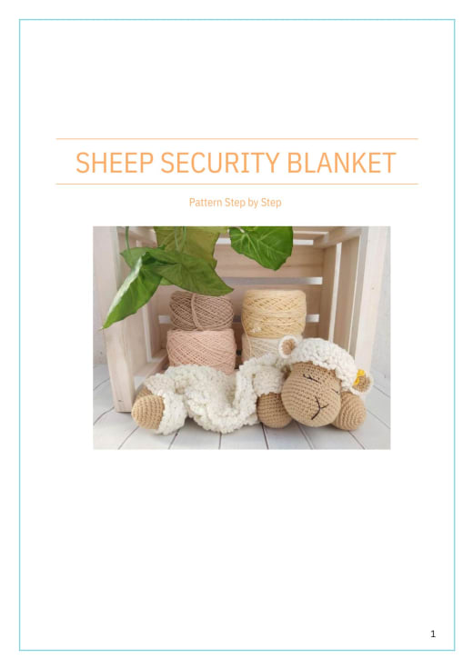 Cream sheep security blanket lovey on a bed