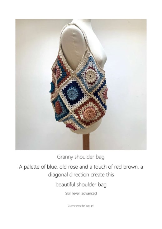 Granny square shoulder bag in blue, old rose and red brown hanging on a hanger