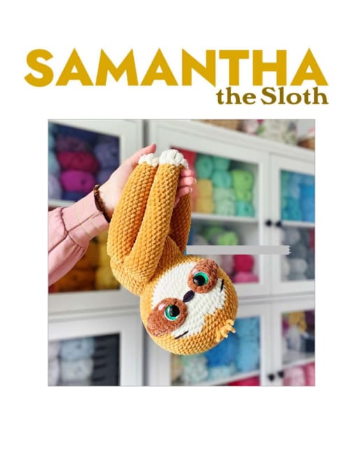 Samantha the sloth amigurumi hanging with her long arms
