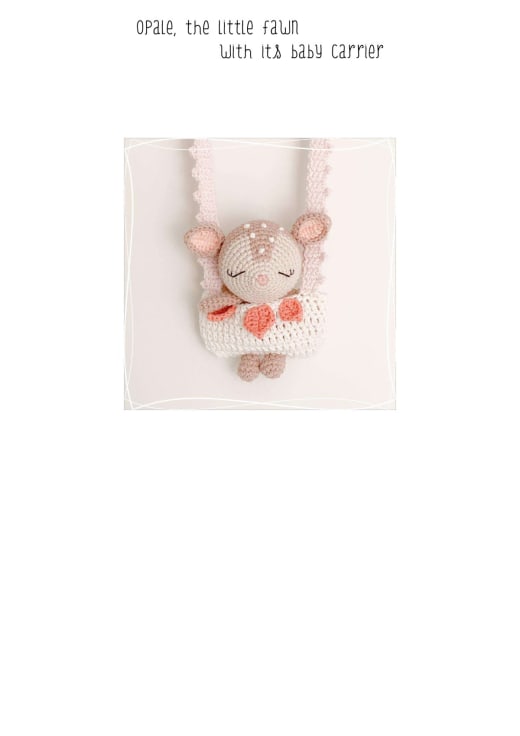 Crochet fawn with pink cheeks in a cream baby carrier with leaf details