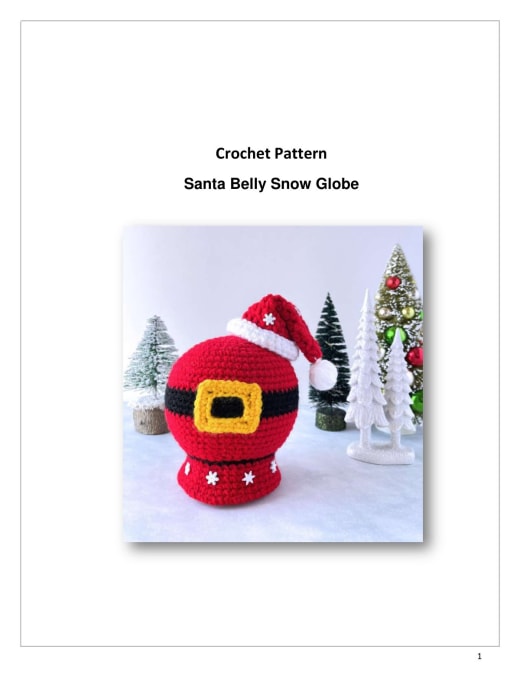 Red crochet snow globe with Santa's black belt and yellow buckle and a mini Santa hat