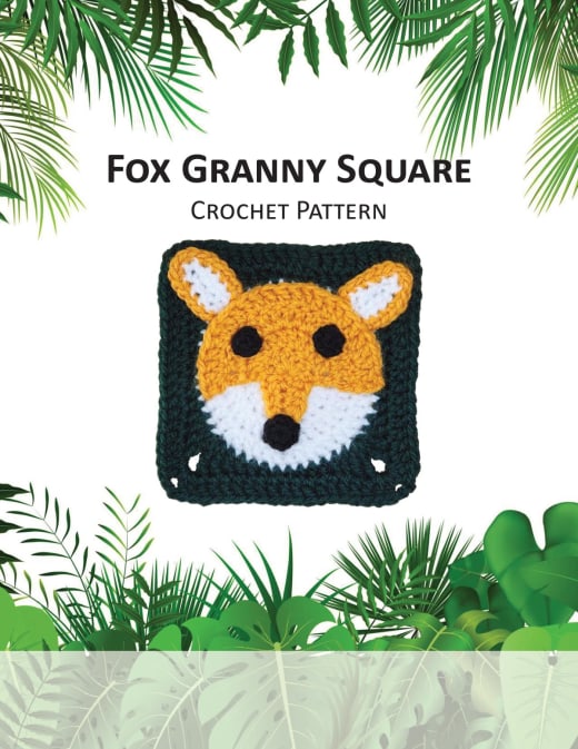 Granny square with an orange fox face on a black background