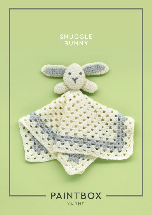 Cream granny square lovey blanket with a grey border and a bunny head in the center
