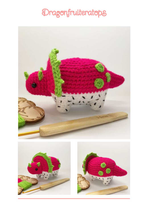 Pink crochet dinosaur that looks like a dragon fruit with green frills