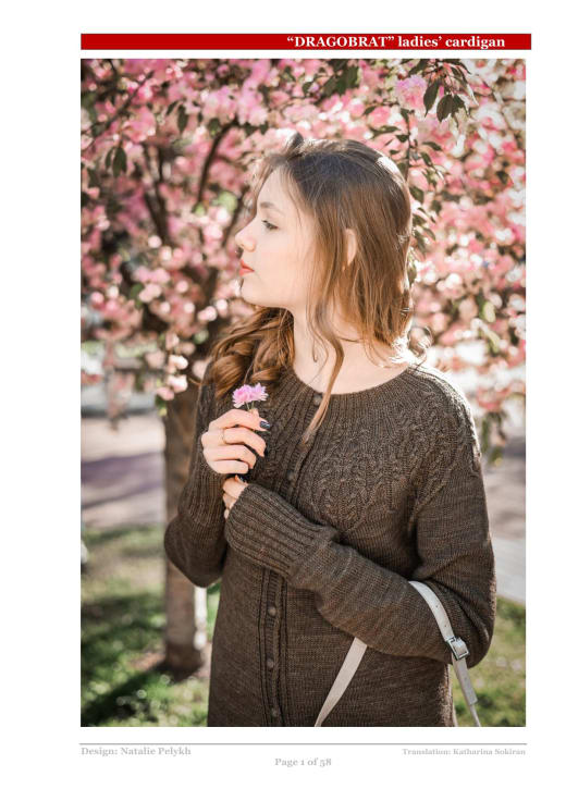 Woman wearing a dark cable knit cardigan outdoors