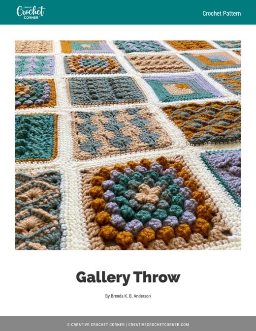 Colorful textured crochet throw with gold, green, caramel and grey squares