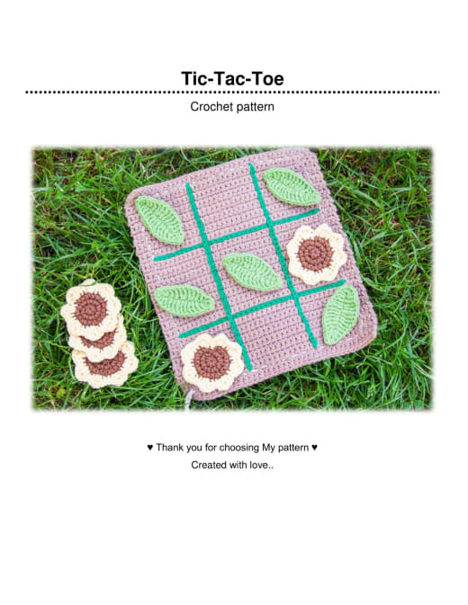 Crochet tic-tac-toe board with sunflower and leaf pieces