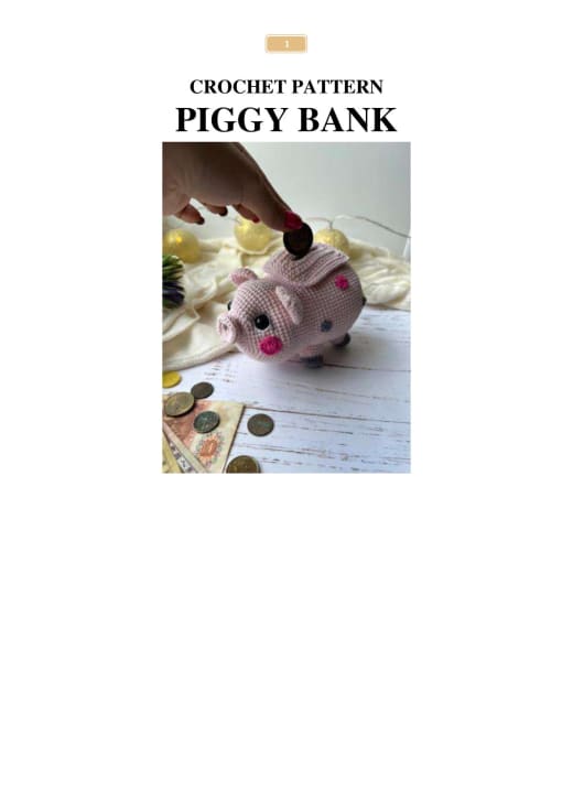 Pink crochet piggy bank with gray spots