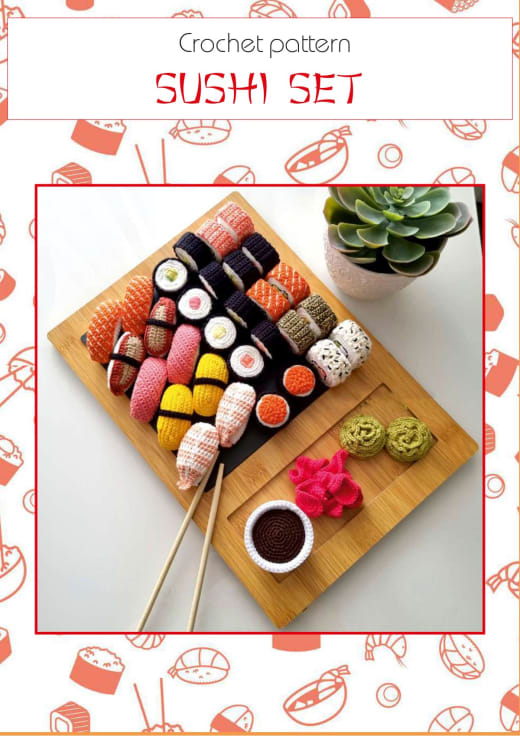 Crochet sushi set on a wooden board with chopsticks and a soy sauce dish