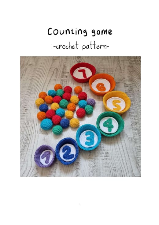 Crochet counting game with rainbow bowls, numbers and colorful balls