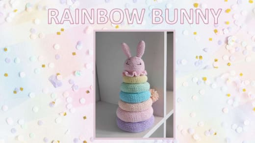 Rainbow bunny stacking toy with pink, purple, blue, green and yellow rings