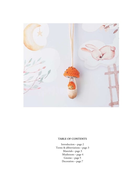 Tiny orange crochet mushroom pendant with a white mouse