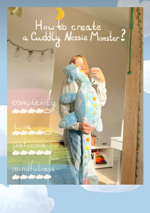 Woman holding a large blue fluffy Nessie monster plush