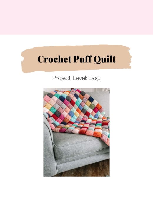 Colorful crochet puff quilt made of stuffed squares on a sofa