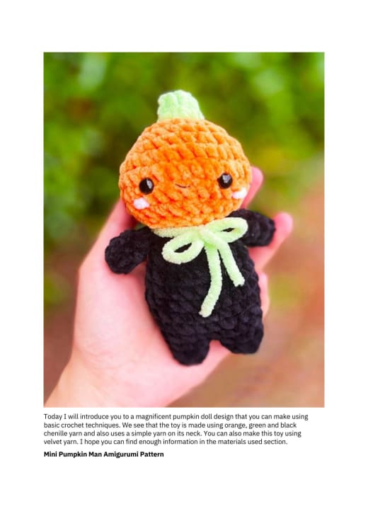 Small crochet pumpkin man with an orange head, green stem and black body held in a hand