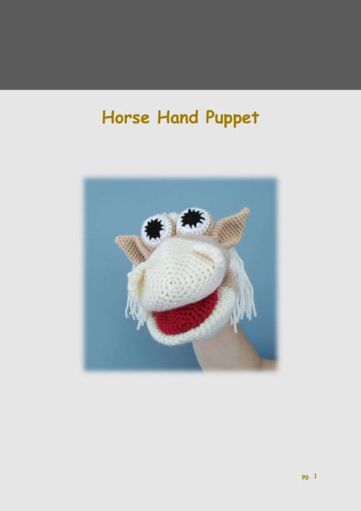 Crochet horse hand puppet with a white yarn mane and big eyes
