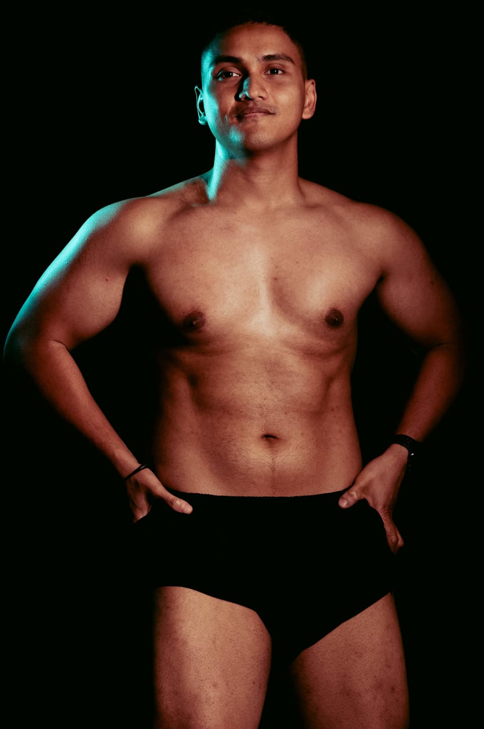Standing portrait, hands on hips, confident stance