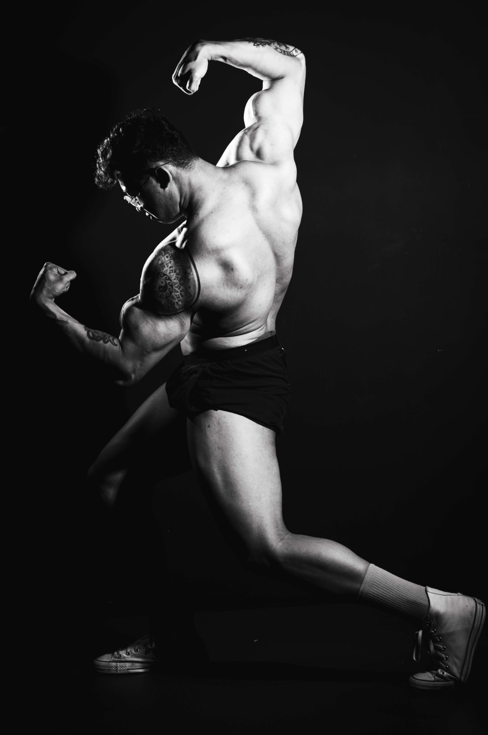 Dynamic lunge pose, dramatic side lighting