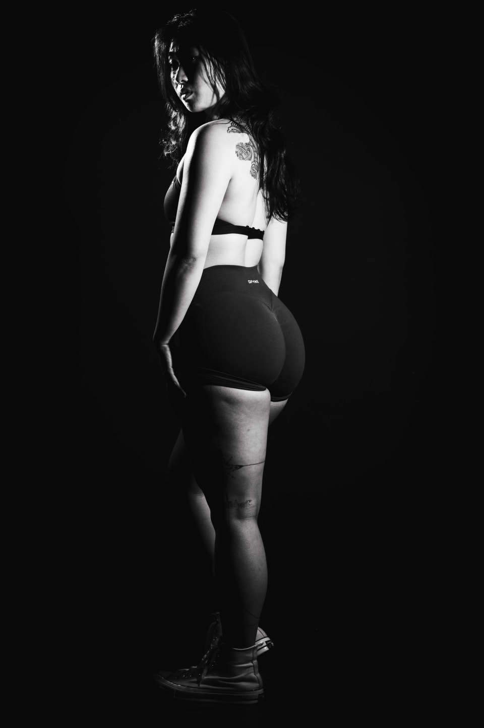 Rear view portrait, black and white studio