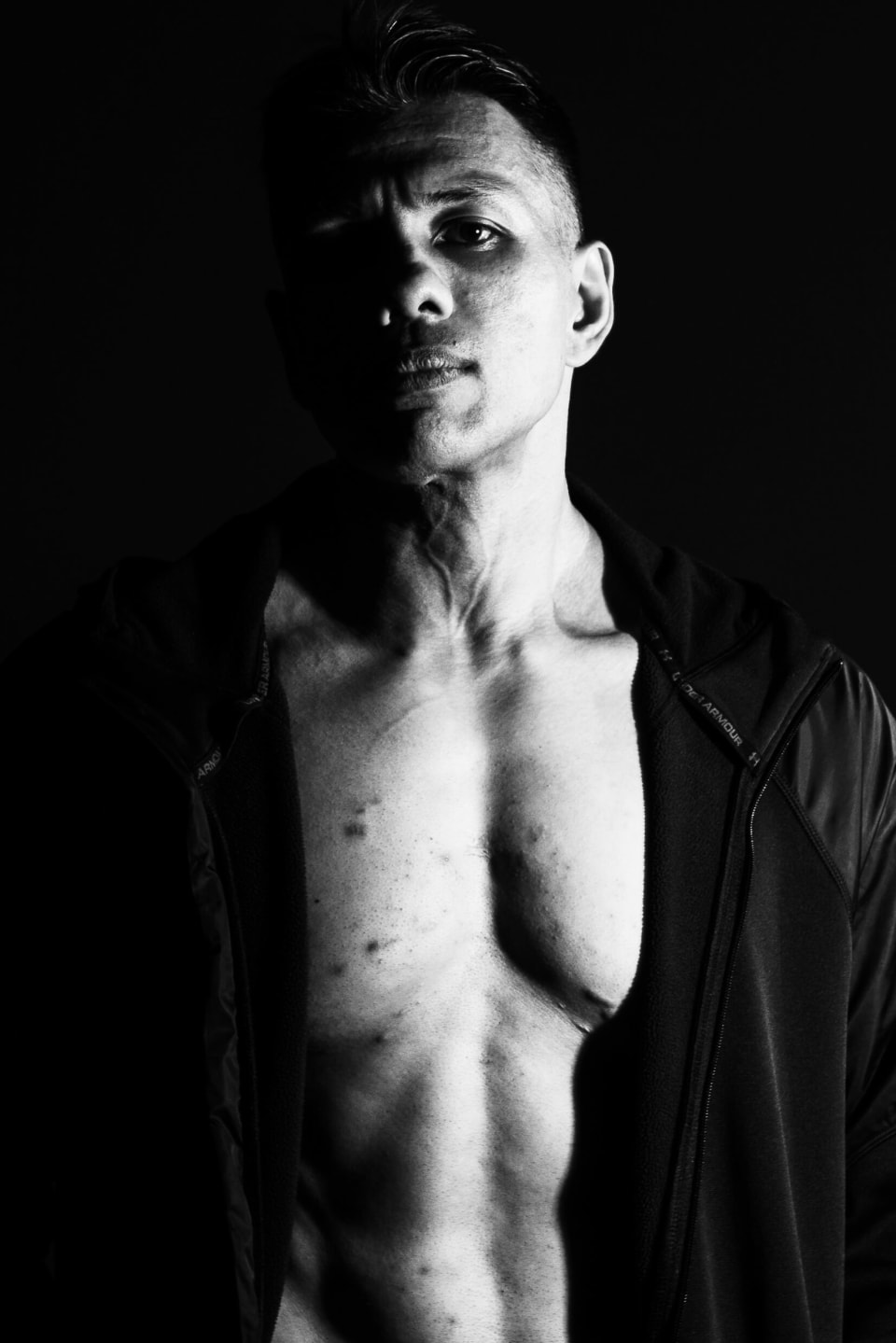 Portrait in open jacket, weathered expression
