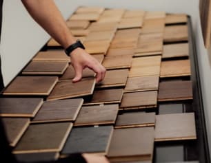 Hand picking wooden flooring samples