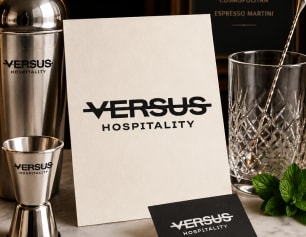 Versus Hospitality brand card next to a cocktail shaker