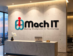 Mach IT logo on an office reception wall