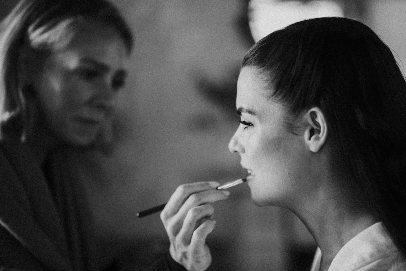 Bride having her makeup finished before the ceremony