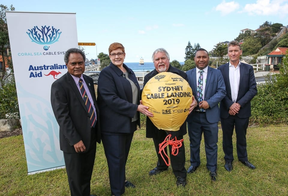 Coral Sea Cable System landing “golden buoy” ceremony Left: Mr Leo Oaeke, Acting Consul General PNG, Senator Hon Marise Payne Minsiter for Foreign Affairs and Minister for Women, Dr Peter McKenzie, La Perouse Aboriginal Land Council Elder, Mr Walter Diamana, Acting High Commissioner for Solomon Islands, Mr Kevin Russell, Managing Director and CEO Vocus Group Ltd (Credit: DFAT/ Peter Morris – Sydney Heads)