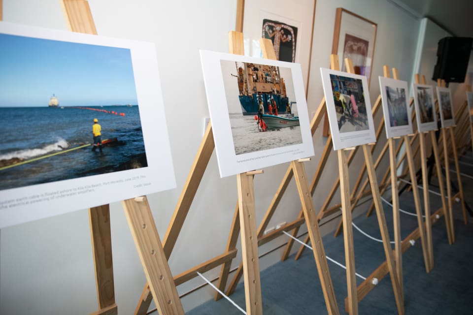 A photographic exhibition celebrating the completion of the Coral Sea Cable System and Solomon Islands Domestic Network was held in December 2019 at Parliament House in Canberra. Showcasing important milestones in the project, the photos capture the magnitude of this infrastructure project, as well as the energy and enthusiasm amongst stakeholders in Papua New Guinea and Solomon Islands around the cable’s potential. (Credit: Nathan Fulton/DFAT)