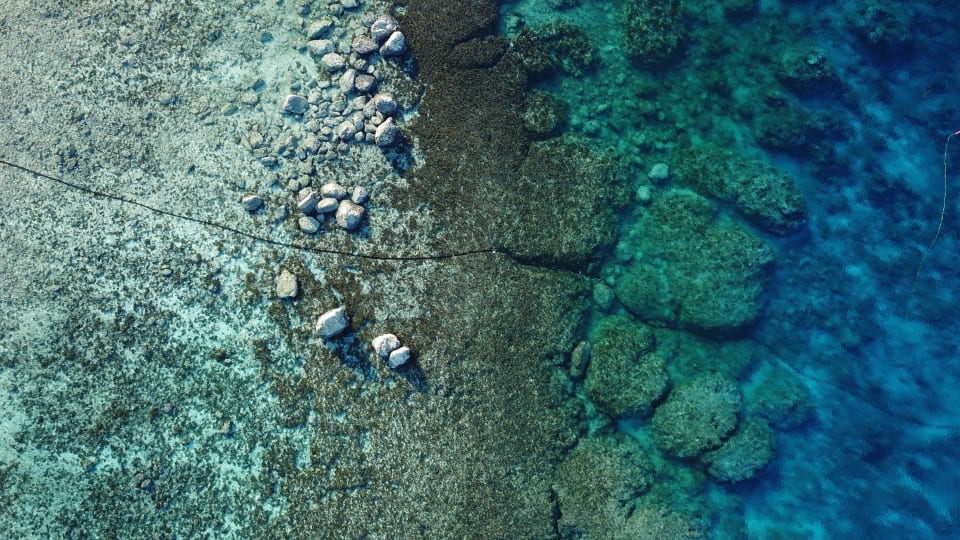 A drone image showing the routing of the cable through the shallow water at the approach to the Auki landing point, prior to the final landing at Noro. (Credit: Kevin Saunders, ASN)