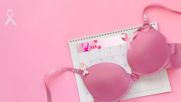 illustration pour le cancer du sein avec un calendrier en bas en office de support et une paire de soutien-gorge rose au dessus avec le symbole du cancer du sein le tout sur un fond rose  