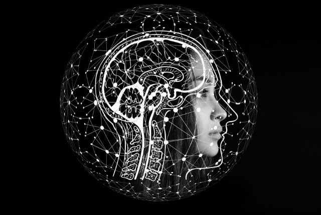 Tumeurs du système nerveux central (SNC). Image en 3D d'un visage et d'un cerveau imbriqués entourés de points lumineux.