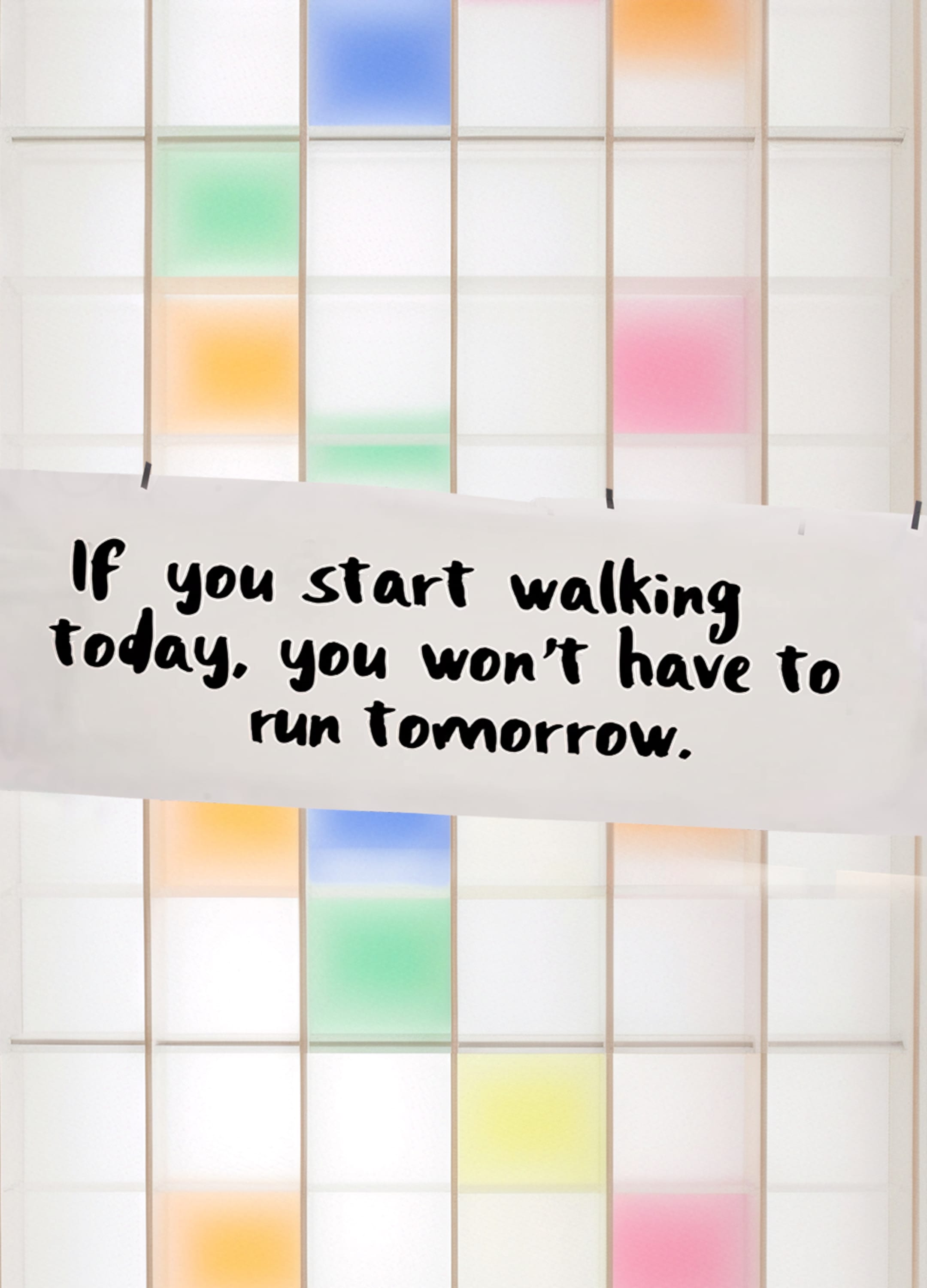 A white shelf with colorful compartments. A piece of paper with a saying hangs on the shelf: If you start walking today, you won't have to run tomorrow.
